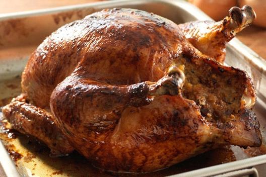How delicious to bake a chicken in an oven with rice filling?